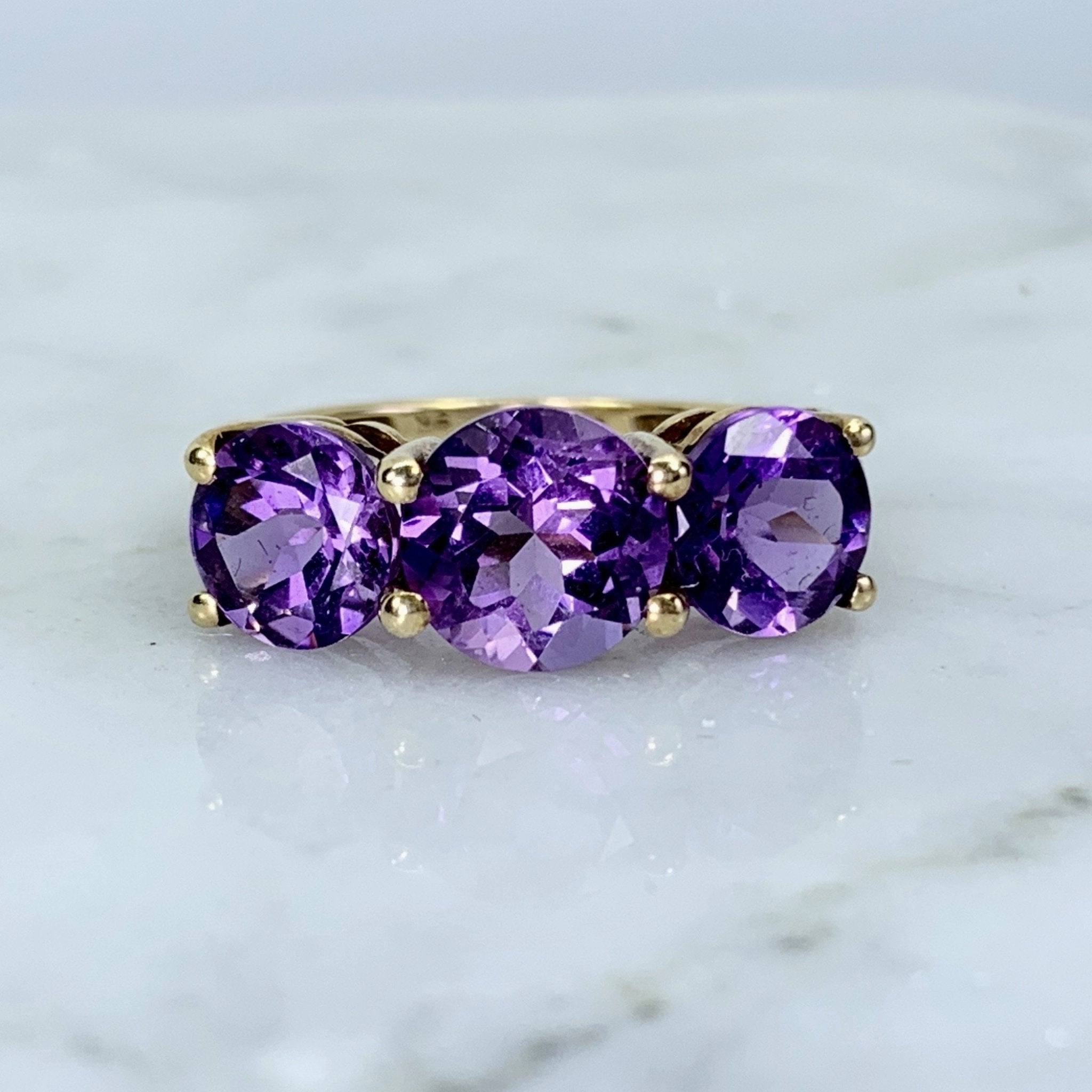 Graceful Look 1970s Amethyst Ring with Three Bright Purple Gemstones set in Yellow Gold. February Birthstone.