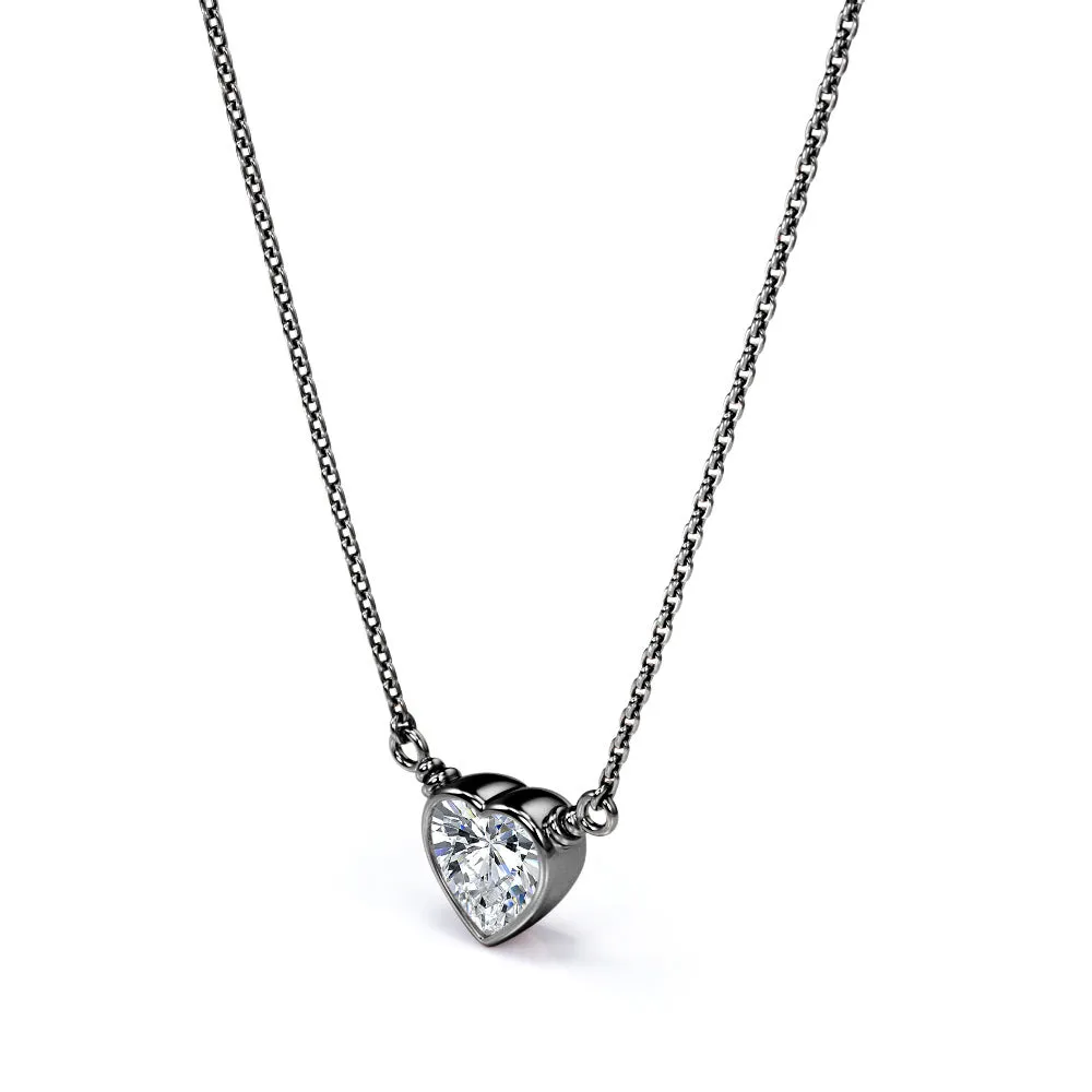 Subtle Edge Vacation Travel Bezel 0.5 carat Heart Moissanite Black Gold Pendant on a Silver Chain