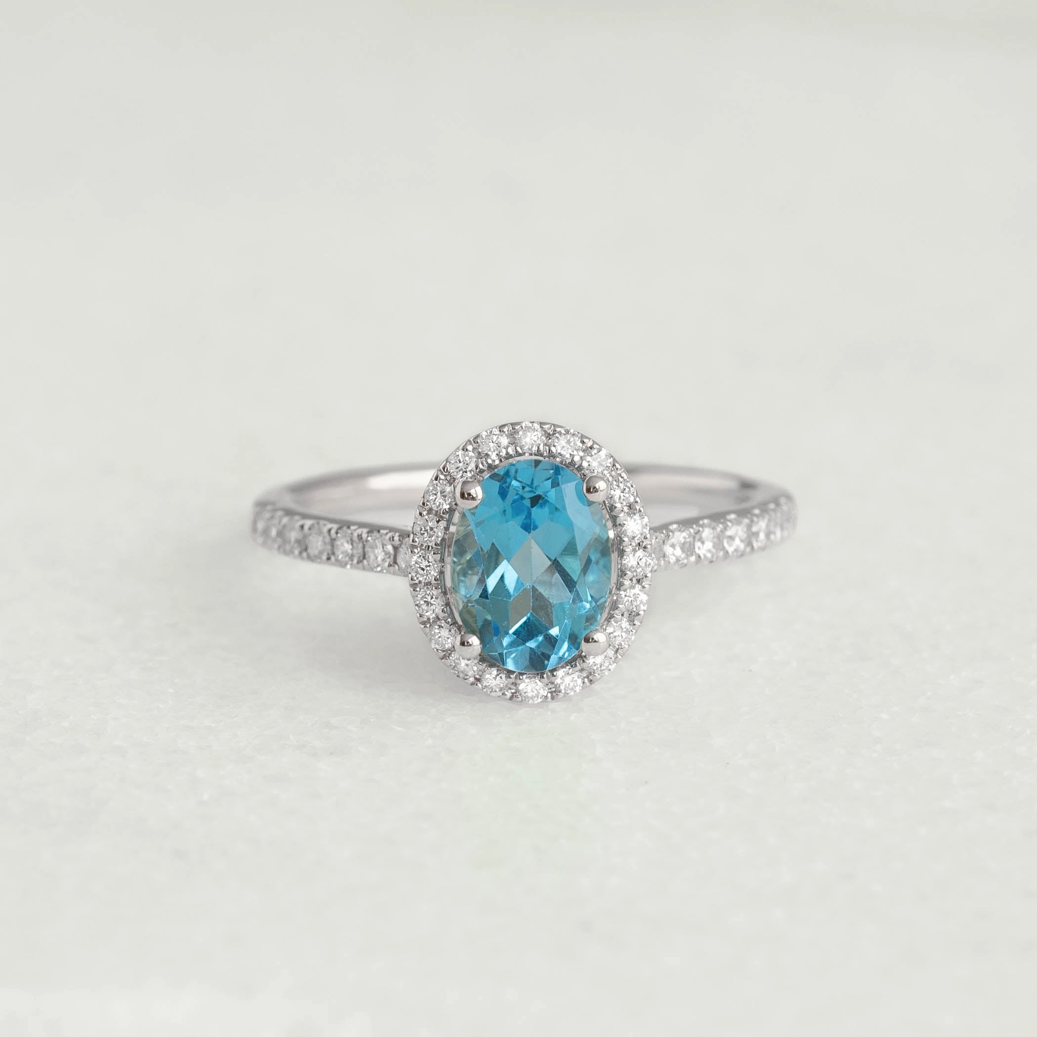 Oval Swiss Blue Topaz Halo Ring White Gold - Suna Timeless Embellishments Sleek Form