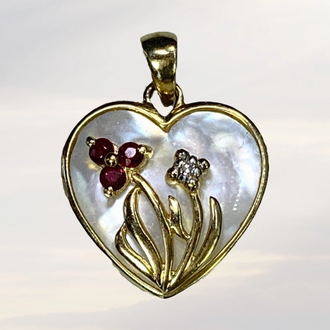 1960s Heart Shaped Mother of Pearl Pendant with Diamond and Ruby Flowers set in 10k Yellow Gold. Travel Style