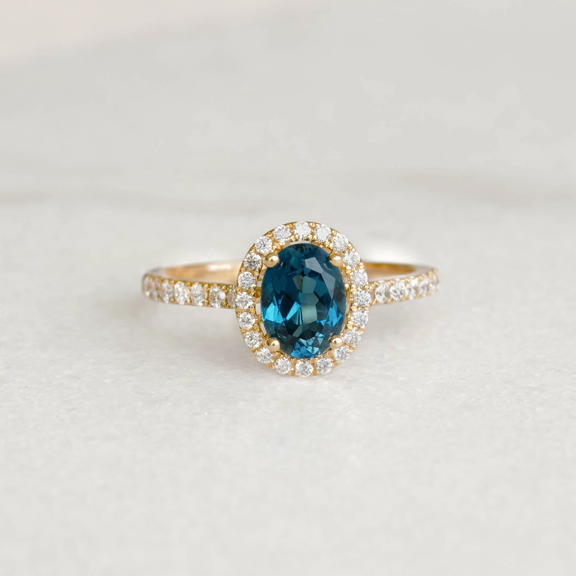 Luxury Spark Modern Detailing Oval London Blue Topaz Halo Ring 14k Gold - Suna